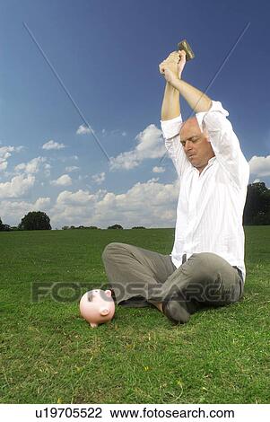 man bout to smash piggy bank View Large Photo Image Stock Image - man bout to smash piggy bank. Fotosearch