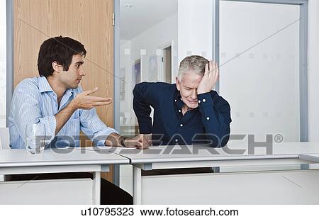 man consoling work colleague View Large Photo Image Stock Image - man consoling work colleague. Fotosearch
