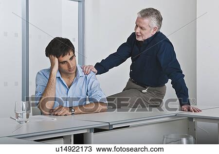 man consoling work colleague View Large Photo Image Stock Image - man consoling work colleague. Fotosearch