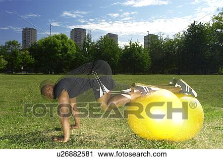 man doing exercises in park View Large Photo Image Stock Image - man doing exercises in park. Fotosearch