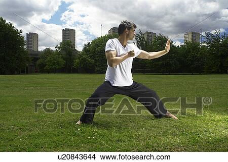 Picture - man doing martial arts. Fotosearch