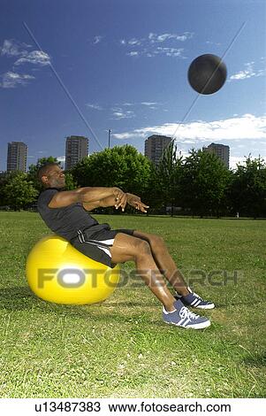 man doing sit ups in park View Large Photo Image Stock Image - man doing sit ups in park. Fotosearch