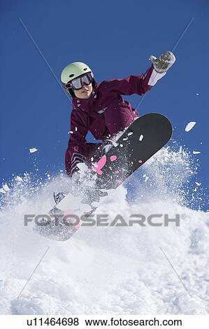 Man grabbing her board mid air. View Large Photo Image Stock Photo - Man grabbing her board mid air.. Fotosearch