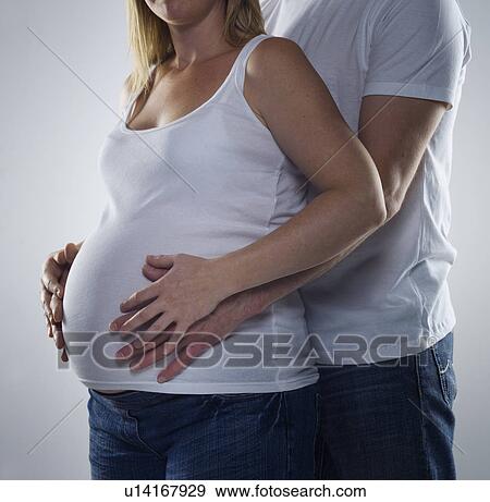 man holding pregnant woman View Large Photo Image Stock Photo - man holding pregnant woman. Fotosearch