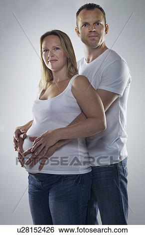 man hugging pregnant woman View Large Photo Image Stock Photograph - man hugging pregnant woman. Fotosearch