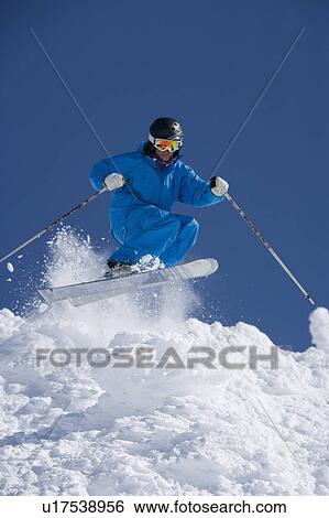 Man in blue jump-suit skiing. View Large Photo Image Stock Photograph - Man in blue jump-suit skiing.. Fotosearch