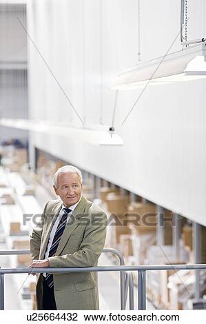 Stock Image - man in charge in storage. Fotosearch