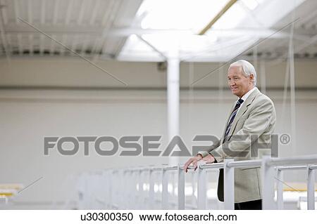 Stock Image - man in charge in storage. Fotosearch