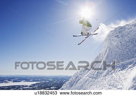 Man in green getting air-time. View Large Photo Image Stock Image - Man in green getting air-time.. Fotosearch
