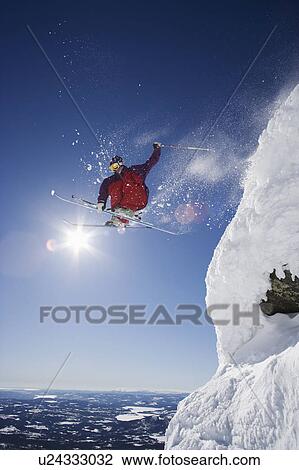 Stock Image - Man in purple airing a gap.. Fotosearch