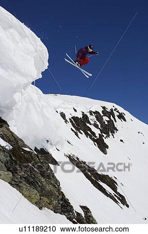 Stock Image - Man in purple dropping a gap.. Fotosearch