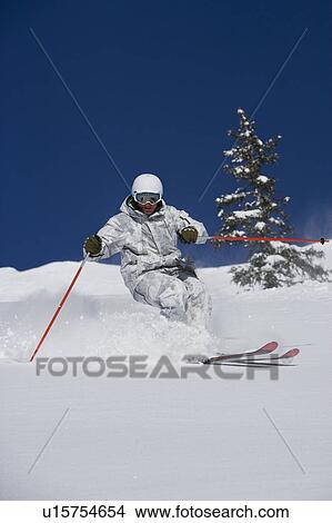 Man in white & grey camo suit off-piste. View Large Photo Image Picture - Man in white & grey camo suit off-piste.. Fotosearch