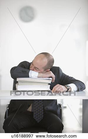 man is sleeping in office View Large Photo Image Stock Photo - man is sleeping in office. Fotosearch