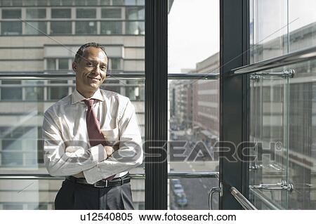man leaning at window smiling View Large Photo Image Stock Photography - man leaning at window smiling. Fotosearch