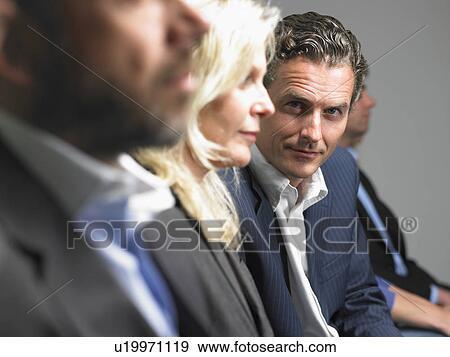 Man looking at camera during conference View Large Photo Image Stock Photo - Man looking at camera during conference. Fotosearch