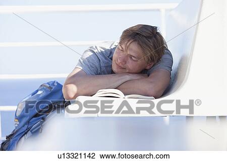 Man lying on bench View Large Photo Image Stock Image - Man lying on bench. Fotosearch