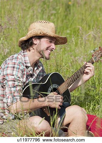Stock Photograph - man playing guitar. Fotosearch