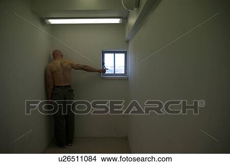 Picture - man pointing to window. Fotosearch
