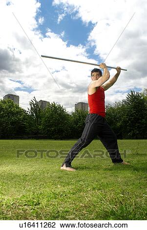 man posing with bow staff View Large Photo Image Stock Image - man posing with bow staff. Fotosearch