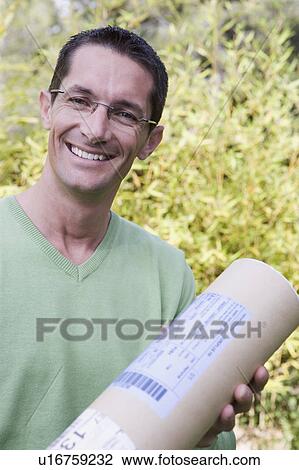Stock Image - man receiving a box. Fotosearch