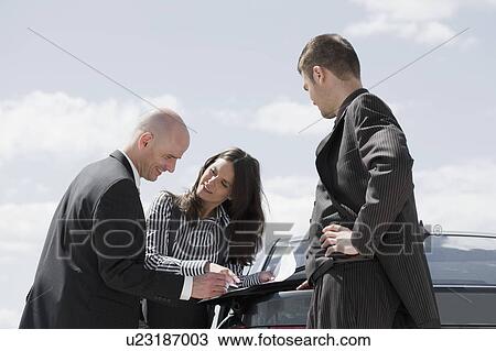 man signing contract on back of car View Large Photo Image Stock Image - man signing contract on back of car. Fotosearch
