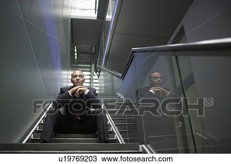 man sitting on stair steps View Large Photo Image Stock Image - man sitting on stair steps. Fotosearch