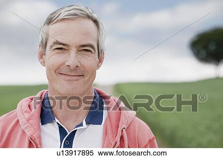 Stock Photography - Man smiling at viewer. Fotosearch
