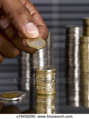 Man stacking euro coins View Large Photo Image Stock Photography - Man stacking euro coins. Fotosearch