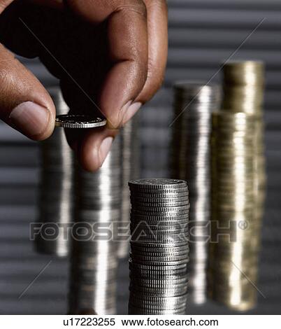 Man stacking sterling coins View Large Photo Image Stock Photography - Man stacking sterling coins. Fotosearch