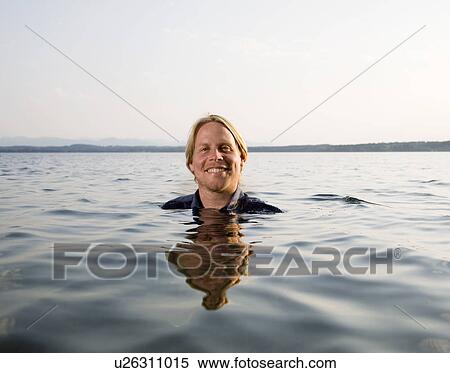 man standing in lake View Large Photo Image Stock Photography - man standing in lake. Fotosearch
