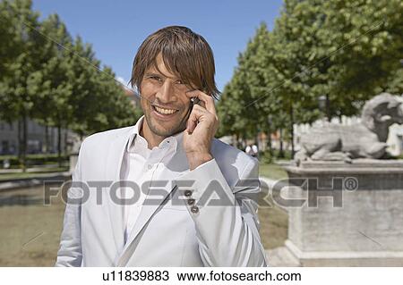 Man talking on the phone View Large Photo Image Stock Image - Man talking on the phone. Fotosearch