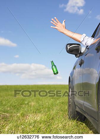 man throwing bottle away View Large Photo Image Stock Photograph - man throwing bottle away. Fotosearch