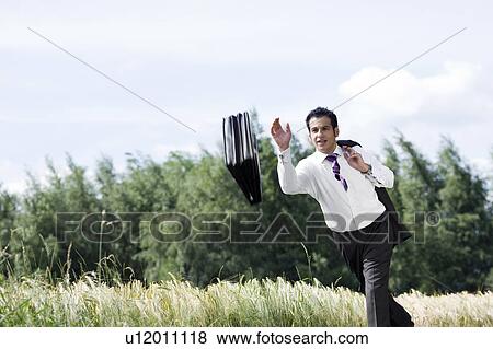 man throwing briefcase View Large Photo Image Stock Photo - man throwing briefcase. Fotosearch