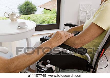 man touching woman in wheelchair View Large Photo Image Stock Photography - man touching woman in wheelchair. Fotosearch