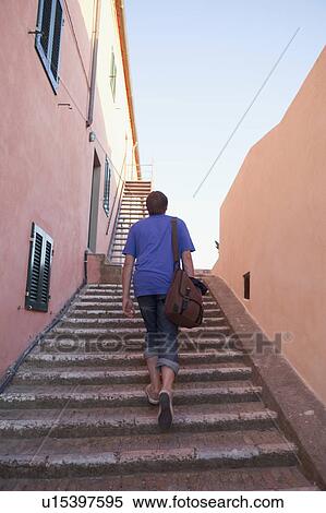 Man walking up stone stairs View Large Photo Image Stock Photography - Man walking up stone stairs. Fotosearch