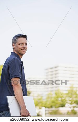 Man Walking With Laptop View Large Photo Image Stock Image - Man Walking With Laptop. Fotosearch