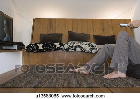 man's legs in front of TV View Large Photo Image Stock Photography - man's legs in front of TV. Fotosearch