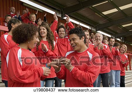 Stock Photo - Marriage proposal at football match. Fotosearch