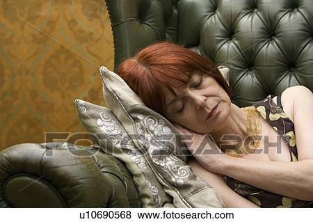 Mature lady Sleeping on couch View Large Photo Image Stock Photo - Mature lady Sleeping on couch. Fotosearch