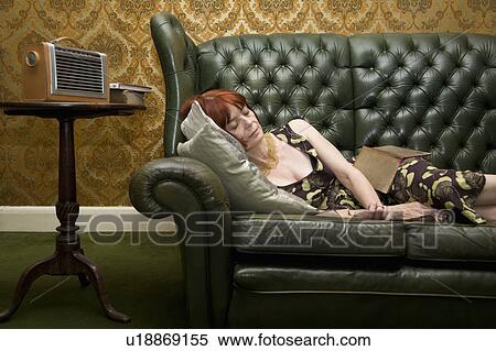 Stock Photography - Mature lady Sleeping on couch. Fotosearch