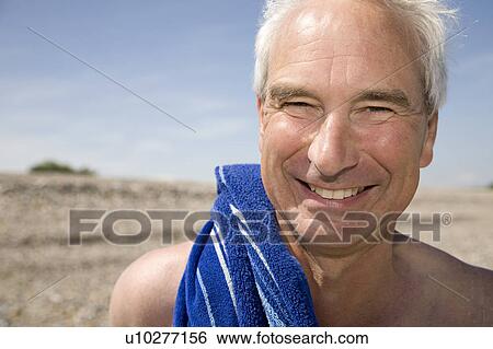 Mature man on beach View Large Photo Image Stock Photograph - Mature man on beach. Fotosearch