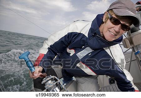 Mature woman sailing View Large Photo Image Stock Photography - Mature woman sailing. Fotosearch