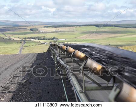 Stock Photo - Mined Coal Traveling on Conveyor Belt. Fotosearch