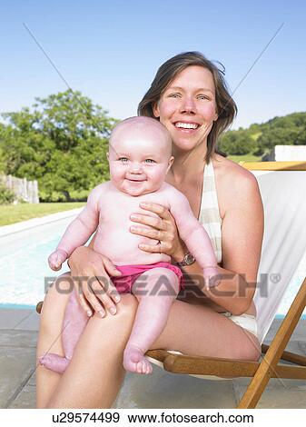 mother and baby by pool View Large Photo Image Stock Photo - mother and baby by pool. Fotosearch