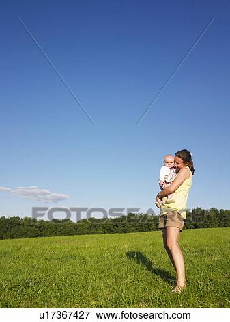 mother and baby in field View Large Photo Image Stock Photo - mother and baby in field. Fotosearch
