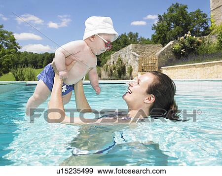 mother and baby in pool View Large Photo Image Stock Photo - mother and baby in pool. Fotosearch