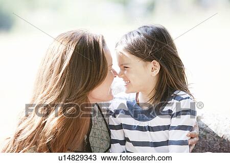 Mother and daughter smiling touch noses View Large Photo Image Stock Image - Mother and daughter smiling touch noses. Fotosearch