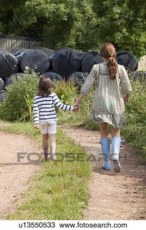 Stock Image - Mother and daughters country walk. Fotosearch