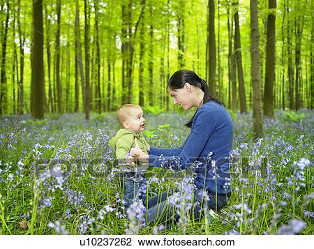 Mother and son in the woods View Large Photo Image Stock Image - Mother and son in the woods. Fotosearch