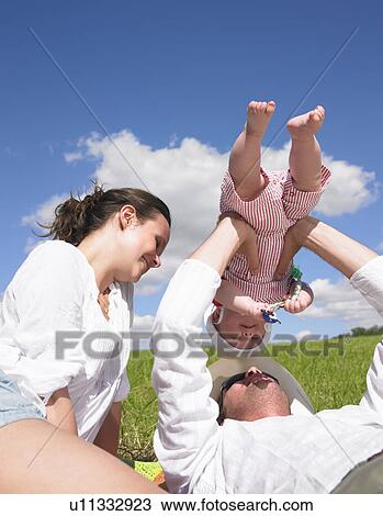mother, father and baby in field View Large Photo Image Stock Image - mother, father and baby in field. Fotosearch